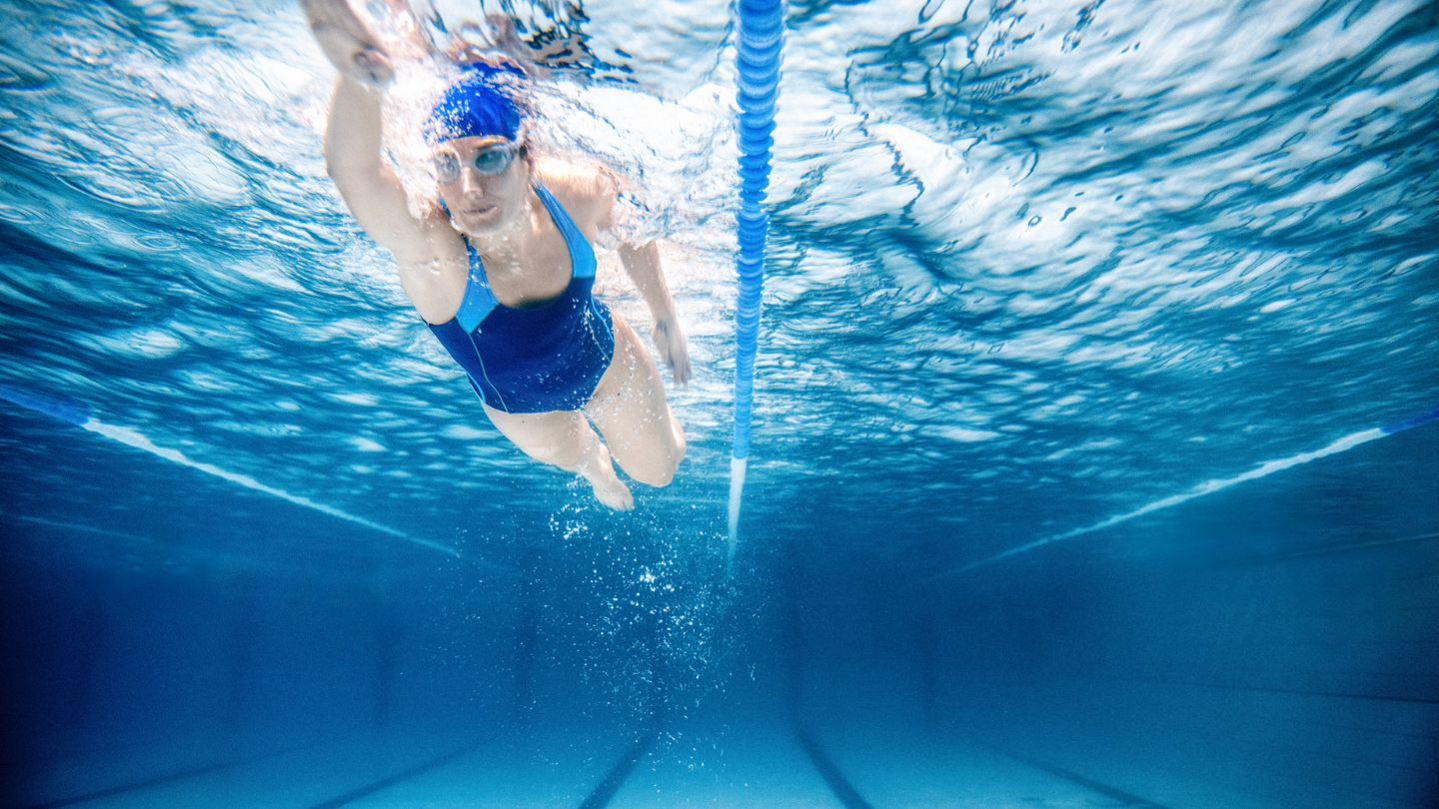 Woman Swimming in Pool