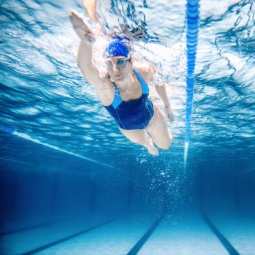 Woman Swimming in Pool